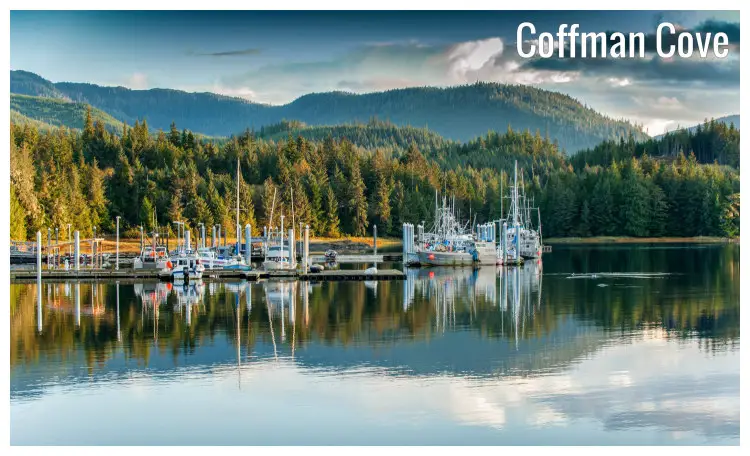 Fishing boats, forest, and mountain ranges in the Coffman Cove, Alaska