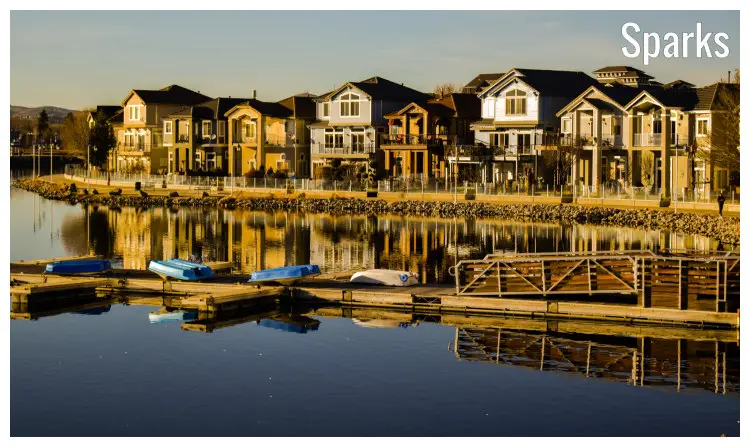 Stunning waterfront homes near a scenic dock with a few empty boats, in Sparks, Nevada