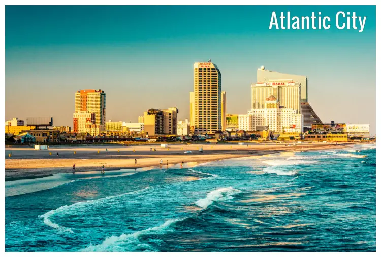 Clear blue waters approaching the sandy beach of the distant Atlantic City in New Jersey Clear blue waters approaching the sandy beach of the distant Atlantic City in New Jersey