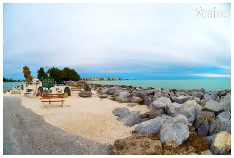 Rocks and pebbles making a scenic view of South Jetty in Venice, Florida, overlooking the calm blue water on either side Rocks and pebbles making a scenic view of South Jetty in Venice, Florida, overlooking the calm blue water on either side