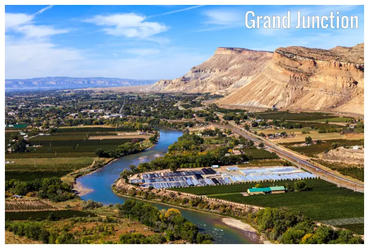 The scenic Grand Junction in Colorado with the iconic Colorado River and high hills nearby