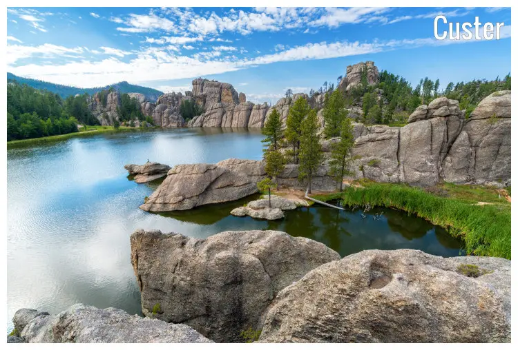 Large, scenic rocks and trees around this tiny Sylvan Lake located in the tranquil Custer State Park in Custer City, South Dakota