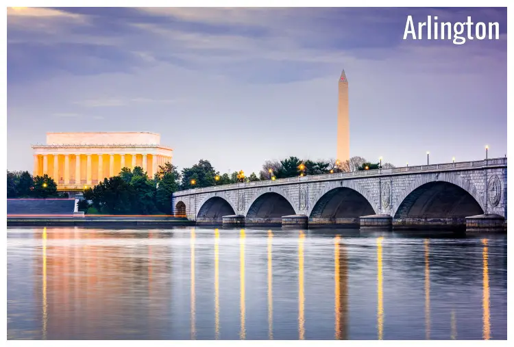 Large iconic Arlington Memorial Bridge over the vast Potomac River in Washington, mirror images of the iconic Lincoln Memorial