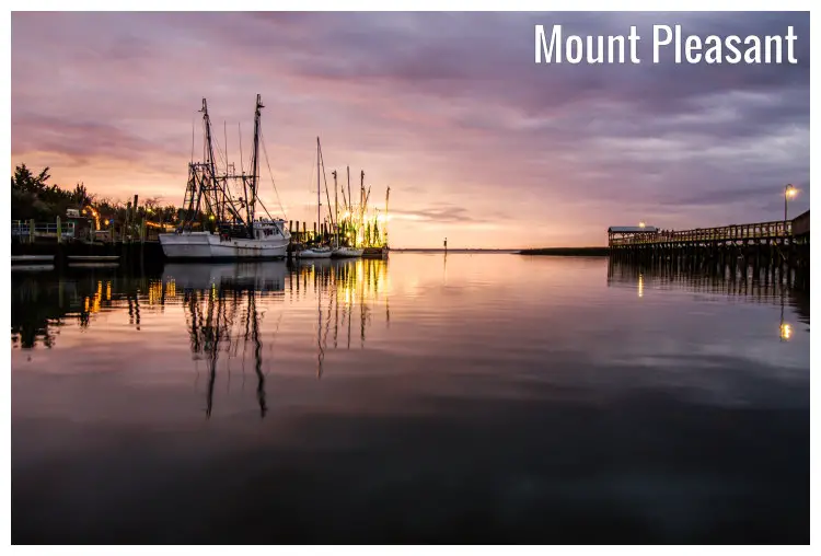 A cute mirror image of the pink sunset sky looming overhead, and the docked fishing boats, with a far view of a high bridge, Mt. Pleasant, SC A cute mirror image of the pink sunset sky looming overhead, and the docked fishing boats, with a far view of a high bridge, Mt. Pleasant, SC