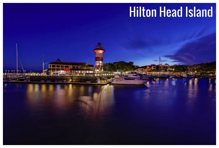 Tall iconic lighthouse seen in a great night view over downtown Hilton Head Island, South Carolina Tall iconic lighthouse seen in a great night view over downtown Hilton Head Island, South Carolina