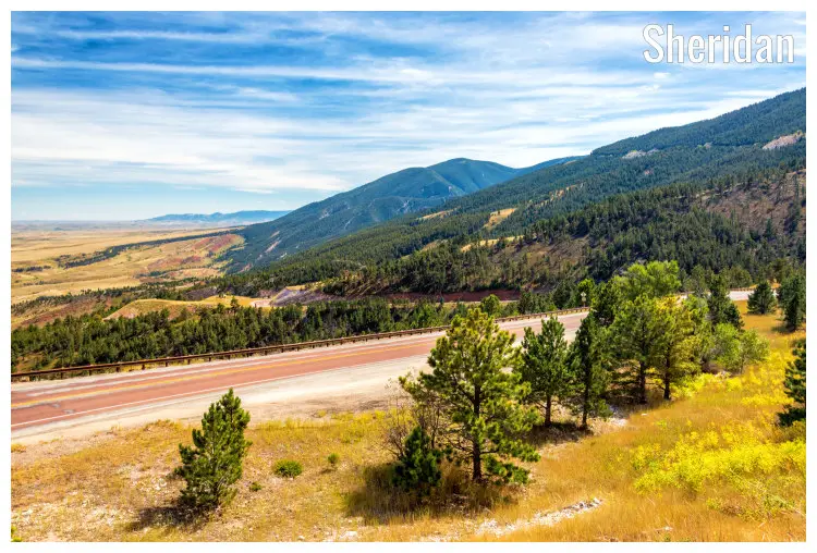 A beautiful and dramatic landscape in the hilly and mountainous region of Sheridan, Wyoming A beautiful and dramatic landscape in the hilly and mountainous region of Sheridan, Wyoming