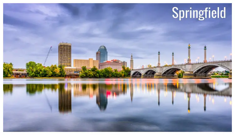 The tall buildings of Springfield, Massachusetts, with a clear mirrored reflection in the water