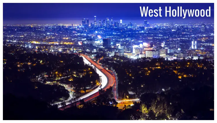 Los Angeles, at dusk with lit buildings and street lights from fast cars, with a view of Highway 101 in West Hollywood City, California Los Angeles, at dusk with lit buildings and street lights from fast cars, with a view of Highway 101 in West Hollywood City, California