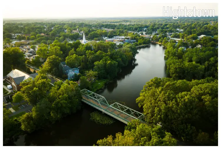 A scenic neighborhood of Hightstown, New Jersey, with the river below, scenic forest, and a clear scape A scenic neighborhood of Hightstown, New Jersey, with the river below, scenic forest, and a clear scape