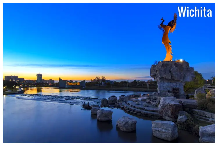 A yellow steel statue at the fork of the Arkansas River, of the iconic and traditional Keeper of the Plains Indian, in Wichita, Kansas A yellow steel statue at the fork of the Arkansas River, of the iconic and traditional Keeper of the Plains Indian, in Wichita, Kansas