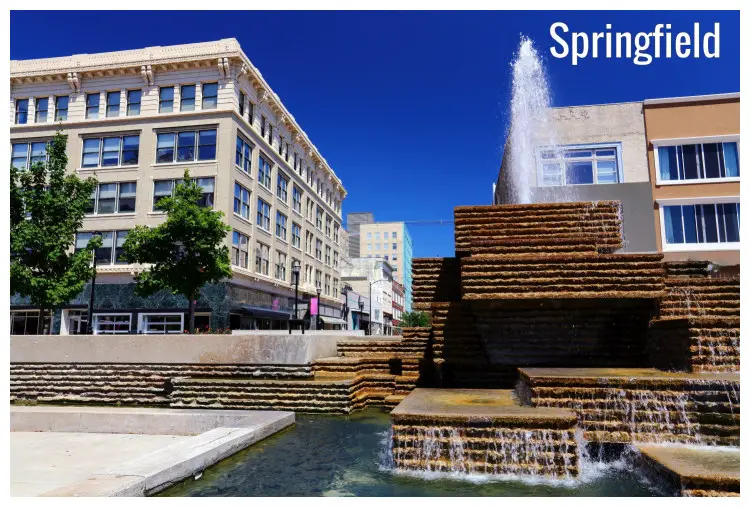 A city square in downtown Springfield, Missouri, with a clean water fountain A city square in downtown Springfield, Missouri, with a clean water fountain
