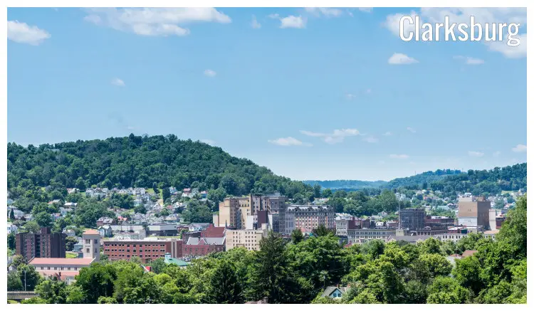 Beautiful cityscape of Clarksburg in West Virginia, with the dense tree cover and the dramatic landscape beyond Beautiful cityscape of Clarksburg in West Virginia, with the dense tree cover and the dramatic landscape beyond