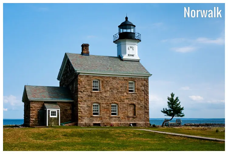 The tourist attraction spot of a stone house home to the Sheffield Island lighthouse in Norwalk, Connecticut