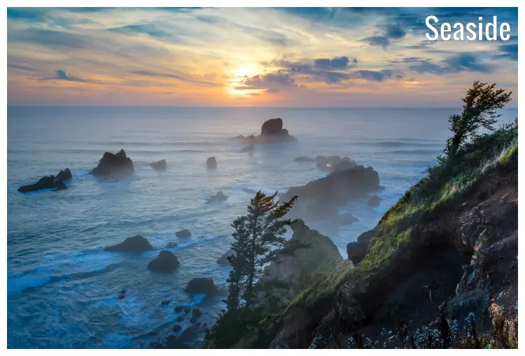 Large rocks in the water on the Seaside shores, Oregon, overlooking the breathtaking sunset view